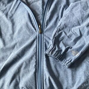 North Face running jacket .Light weight,hood that snaps into collor.